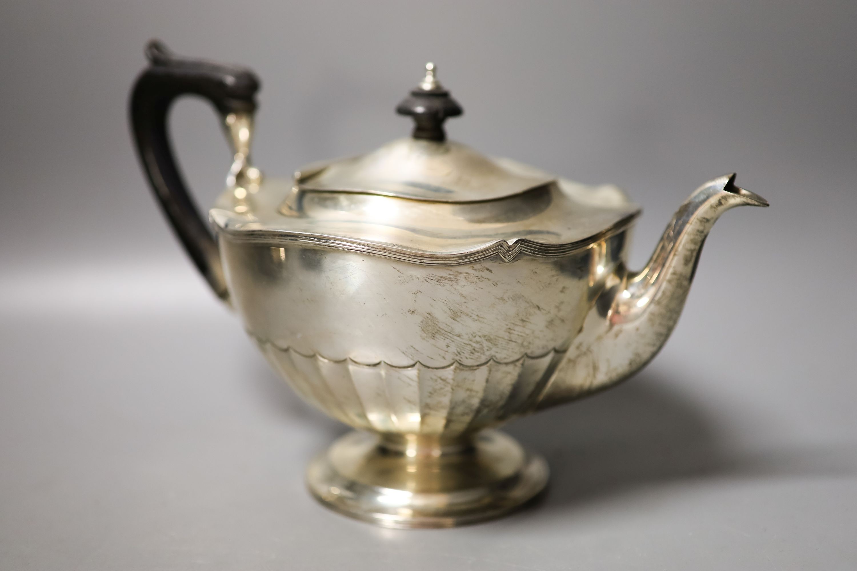 A George V four piece silver circular tea set, Fenton, Russel & Co Ltd, Birmingham, 1912